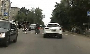 Russian SUV Hits Bike and Runs