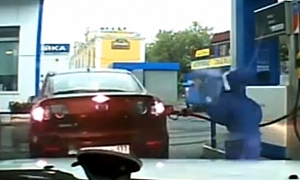 Russian Women Leave Station with Gas Pump Attached