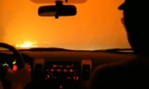 Russians Escape Wildfire by Car