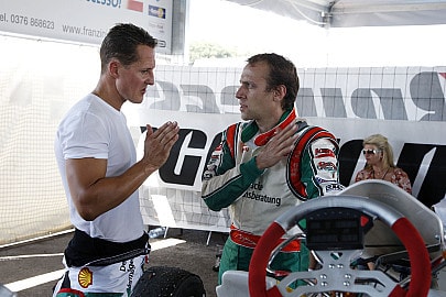 Michael Schumacher talks to Luca Badoer during their karting session at Lonato Circuit