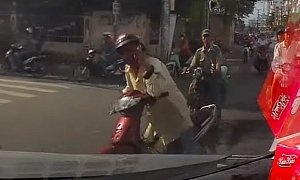 Scooter Rider Won’t Let Go of His Phone Even as He's Crashing