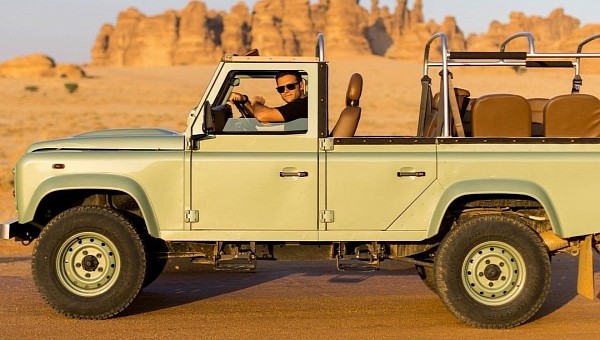 Scott Eastwood in a Land Rover Defender 110