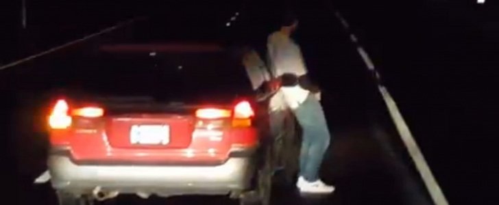 Drunk guy urinating in the middle of the highway