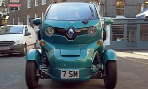 Sir Stirling Moss Drives a Turquoise Renault Twizy in London