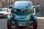 Sir Stirling Moss Drives a Turquoise Renault Twizy in London
