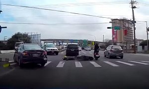Slaloming Scooter Rider Crashes Ridiculously, Almost Takes Anther Rider Down – Video