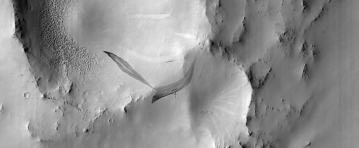 Slope streak on the side of a crater in Arabia Terra region of Mars