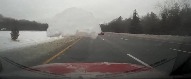 Snow flies off a car's roof