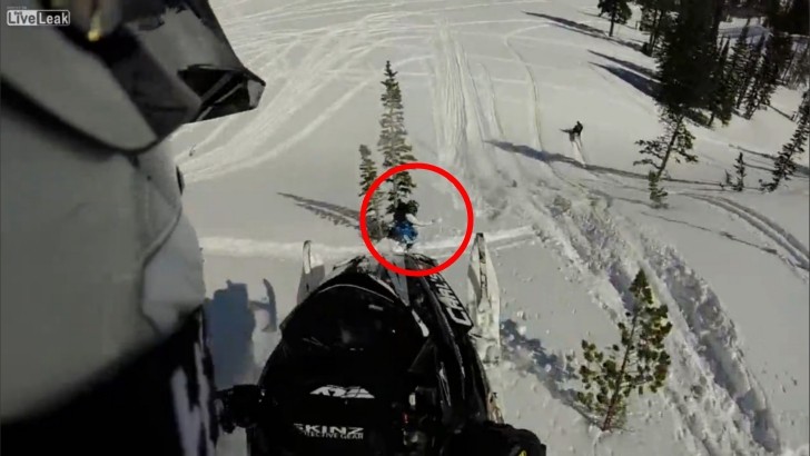 Snowmobile track hitting camera guy's head