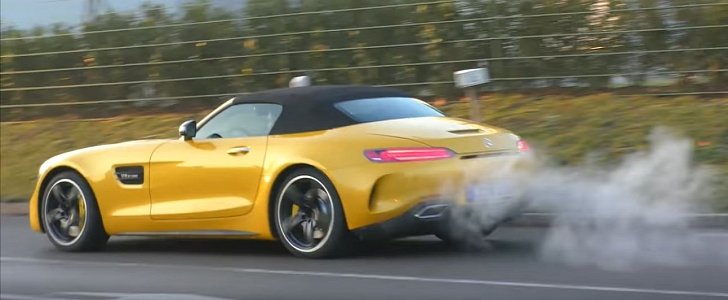 Solarbeam Yellow 2017 Mercedes-AMG GT C Roadster in traffic