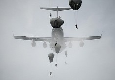 Soldiers Take Strange Shapes as They Drop From a C-17 Globemaster III