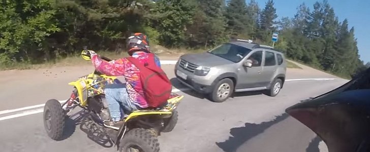 Quad biker loses control, is hit by oncoming car, walks it off