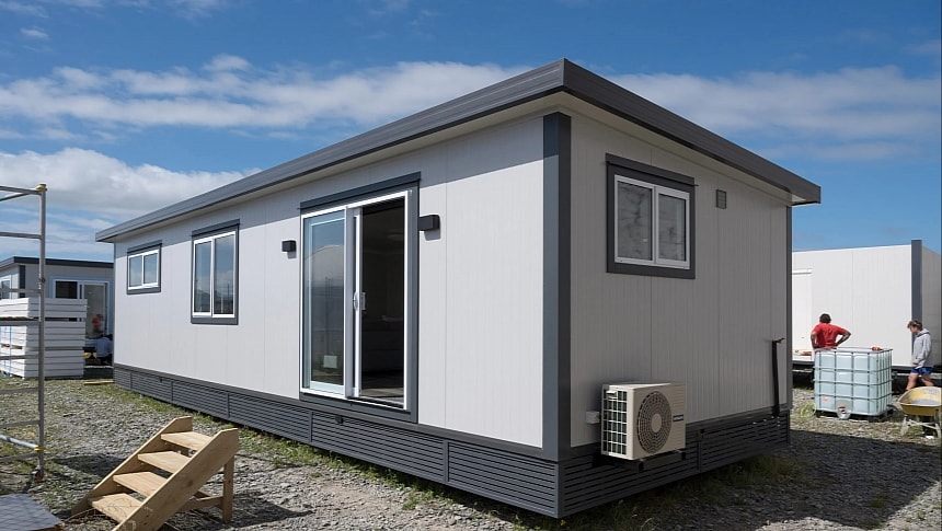 The Russell Tiny Home reveals a modern single-level layout with a luxurious kitchen