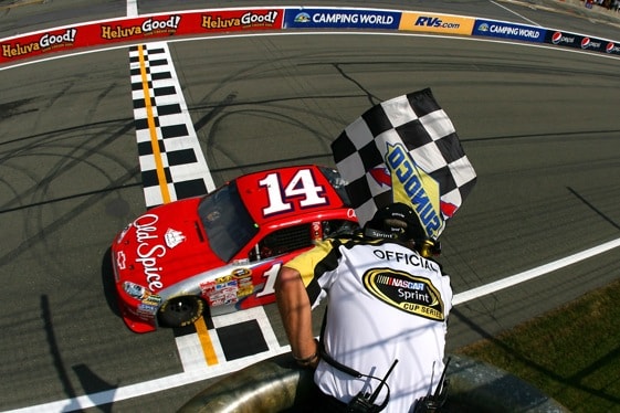 Tony Stewart takes the chequered flag for the first time in the 2009 Chase