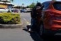 Strange Dude Tries to Eat a Parked Hyundai Santa Fe