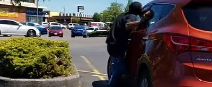 Presumed druggie tries to take a bite out of someone else's Hyundai Santa Fe