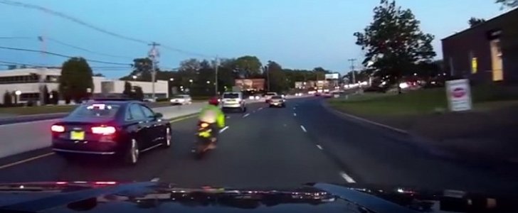 Speeding rider crashes into car