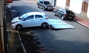Strolling Couple Gets Hit by Driverless Car, Garage Door