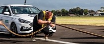 Strongman Gets Ready to Pull Several Cars With His Teeth in a World-Breaking Record