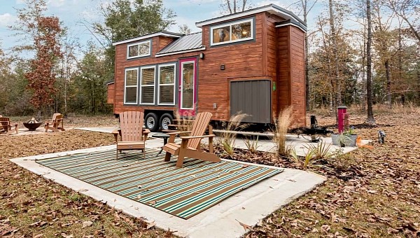 This tiny cabin in the woods reveals a glam, comfortable interior