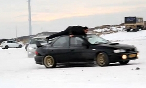 Subaru Impreza Drifting with Man on Roof