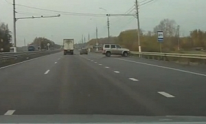 SUV Does Pirouette on Russian Highway