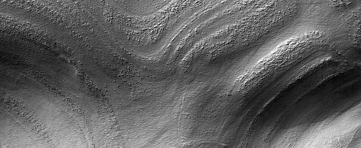 Taffy pull terrain in the Alpheus Colles region of Mars