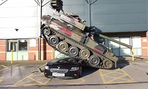 Tank Climbs on Top of a Small 15-Year-Old Roadster; the Car Shakes It Off and Drives Away