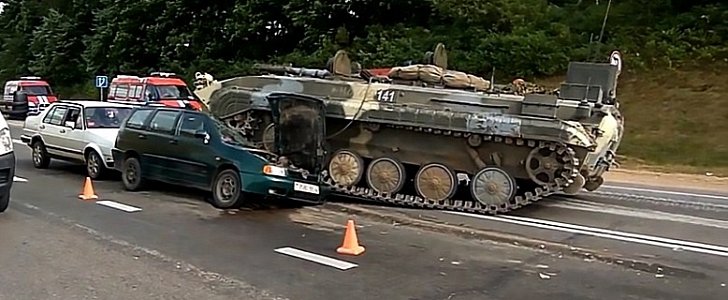 Tank smashes into VW Polo at intersection in Belarus