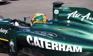 Team Lotus F1 Cars to Sport Caterham Logo at Silverstone
