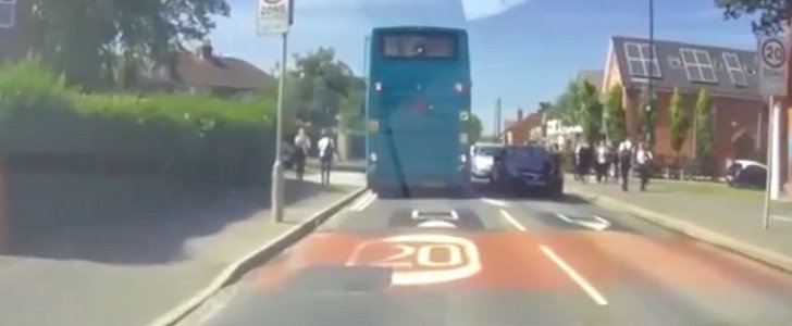 Teen biker rides into oncoming car as he's chasing a bus