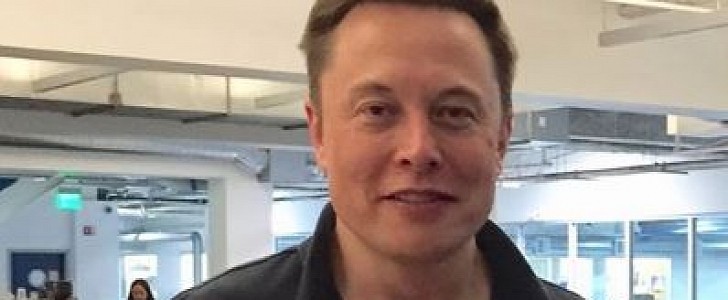 Elon Musk holding "a panic monster" for the 'Gram 