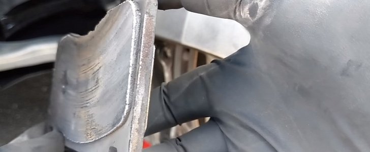Destroyed Tesla Model 3 brake pads