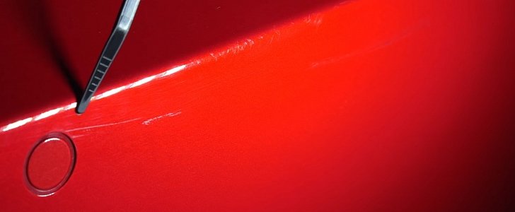 Tesla Model 3 scratched paint
