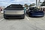 New Tesla Model 3 Gets Dwarfed by the Cybertruck While Resting at a Supercharger