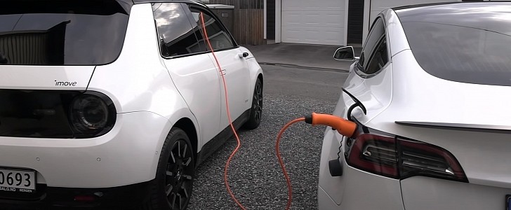 Honda e charging Tesla Model S