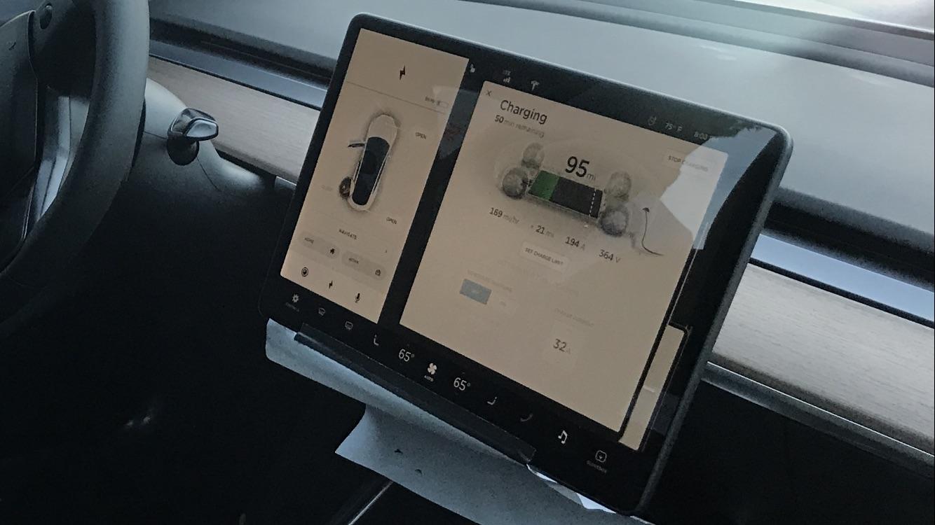 tesla model 3 user interface photographed while supercharging