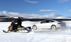 Tesla Model S P85D Drag Races a Snowmobile on Ice Lake in Norway