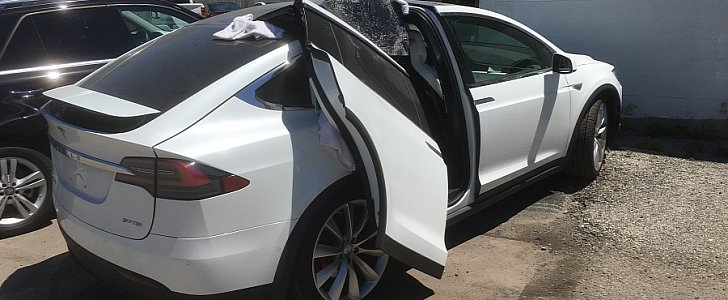 Tesla Model X with broken falcon door