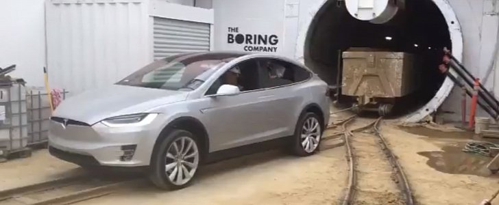 Tesla Model X pulling minecarts