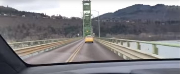 Tesla Model X on narrow bridge