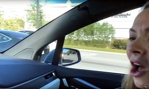 Tesla Model X Owners Hilariously Lose It When They Spot a Model 3 on the Road