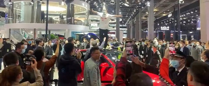 Tesla Owner Climbs on a Model 3 at Auto Shanghai 2021 Over Brake Failure