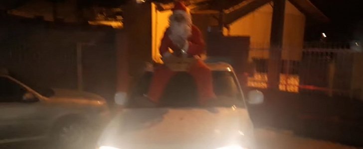 Drunk Santa arrives at party on the hood of a Chevy