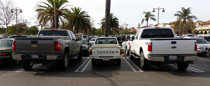 Toyota Pickup next to modern day pickups