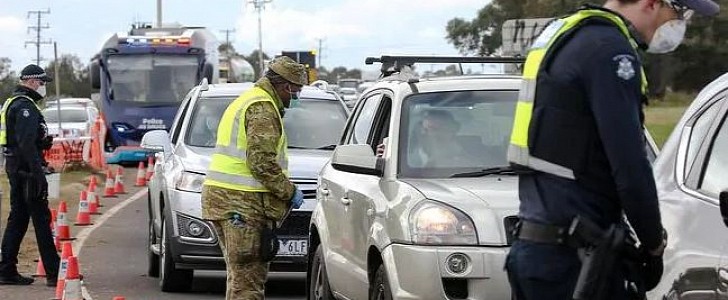 Australian police conduct road blocks as part of reinstated restrictions