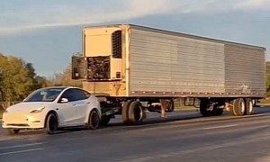 The Craziest Thing You'll See Today Is a Tesla Model Y Towing Massive Semi Trailer
