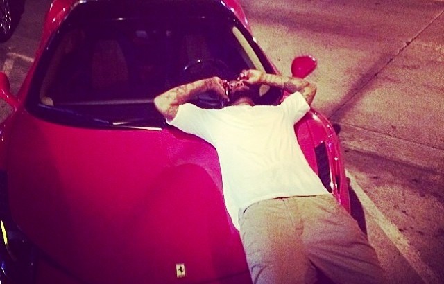 The Game Is Chilling on the Hood of a Ferrari 458