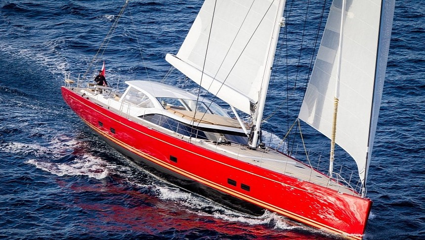 Doryan is a rare red-hulled sailing yacht with a custom layout and top performance