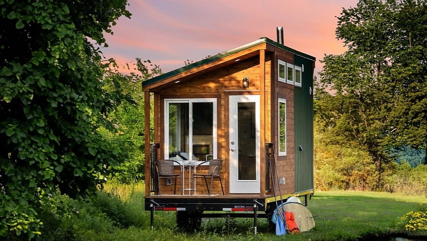 The Little Lodge is a single-level tiny with a compact porch